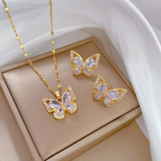 "Luxe Steel Butterfly Glow Set – Clear Gem Earrings & Pendant for Her"